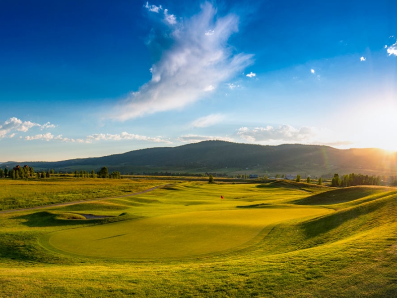 Golf hole at sunset
